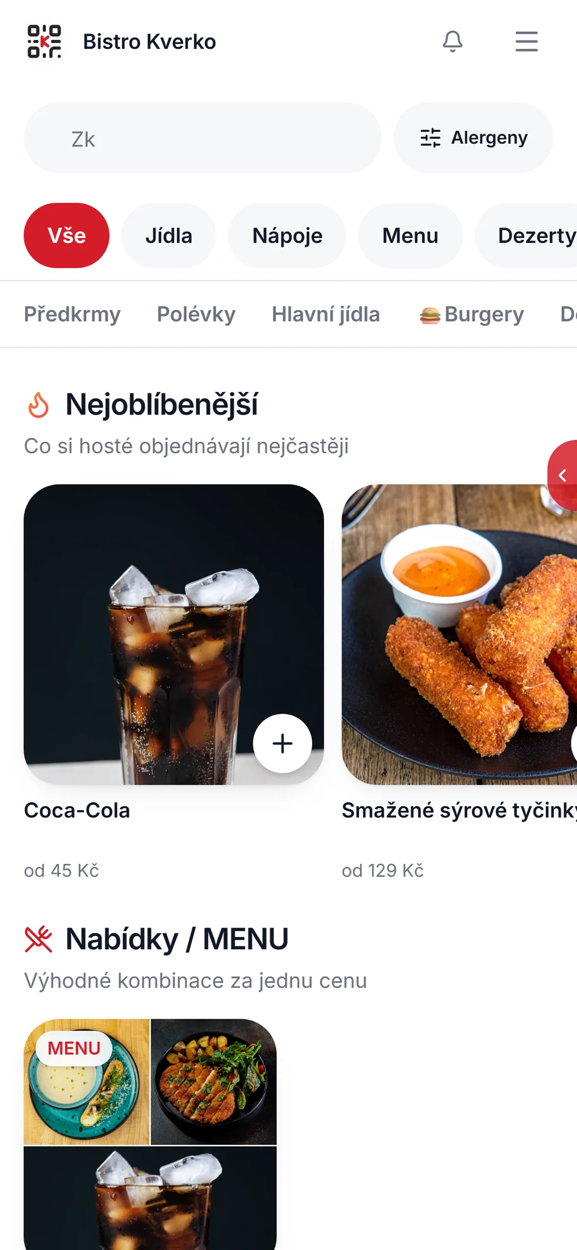 Menu s fotkami jídel otevřené v telefonu hosta u stolu